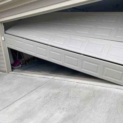 Garage door off its track