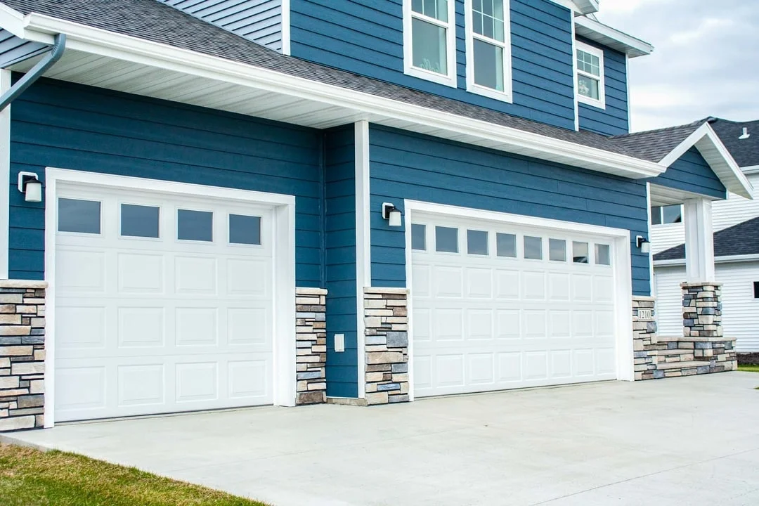 Sectional steel garage door installation in Denver