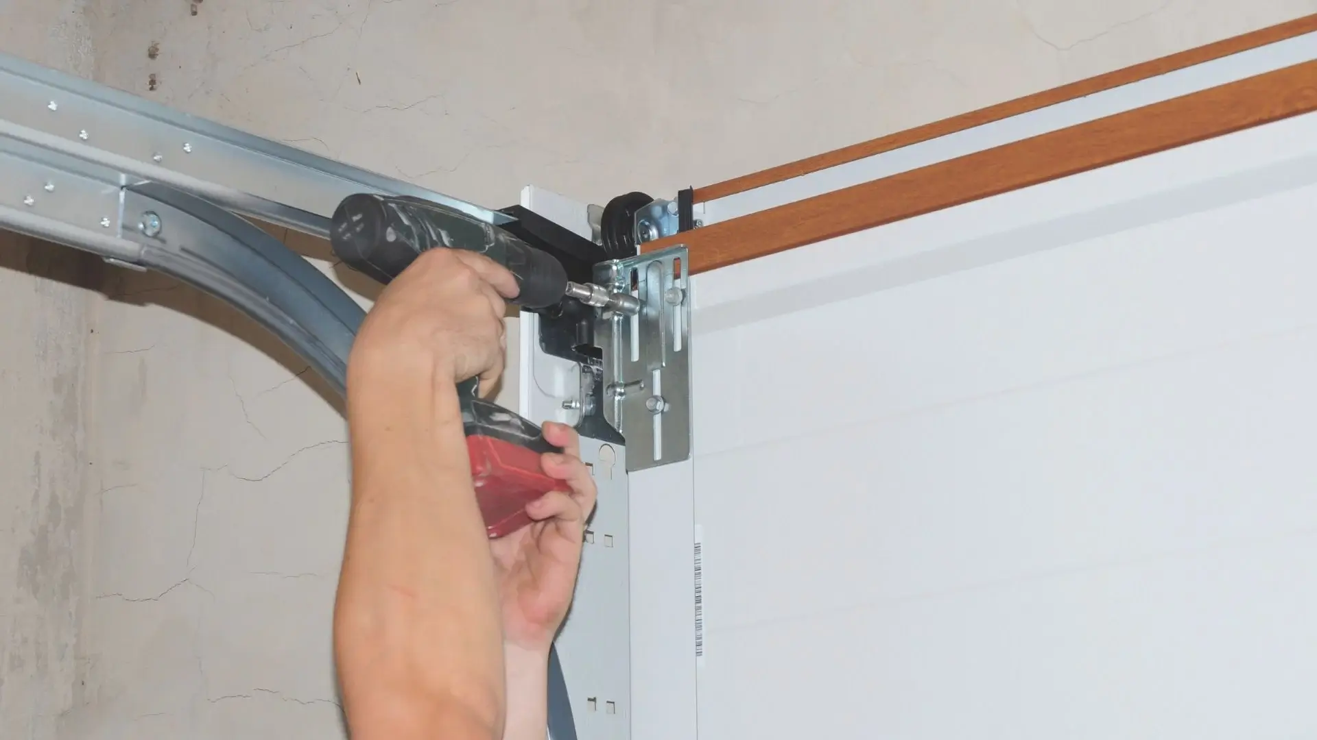 Garage door track repair technician in Denver, CO